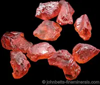 9 Rough Spessartite Crystals