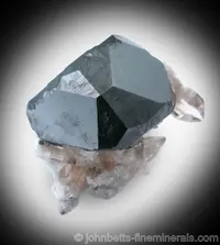 Complex Bixbyite Crystal with Topaz