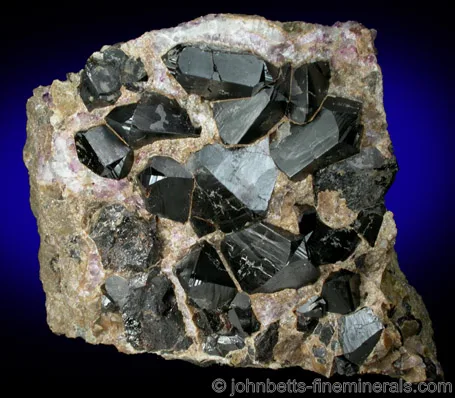 Twinned Cassiterites In Matrix