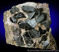 Twinned Cassiterites In Matrix