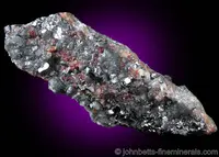 Red Chondrodite Grains in Magnetite